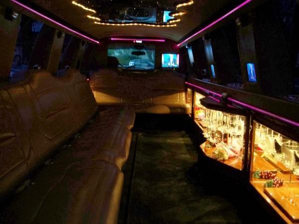 Enjoy your journey in style with a limo with lights and a bar. 